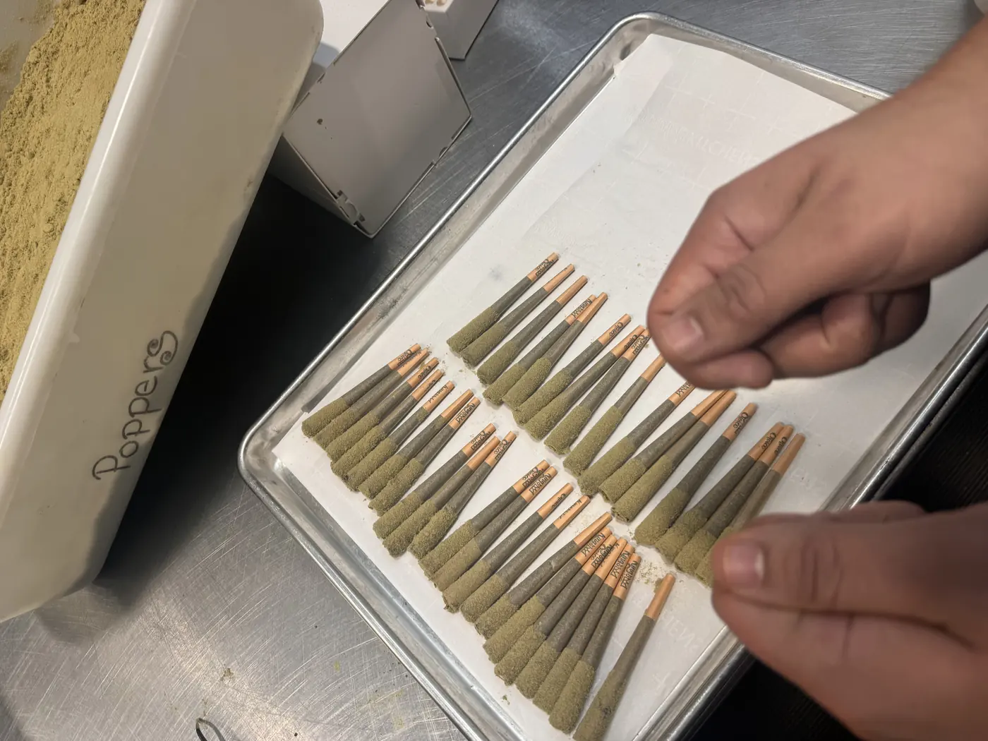 Kief-coated King's Choice infused pre-rolls on a tray